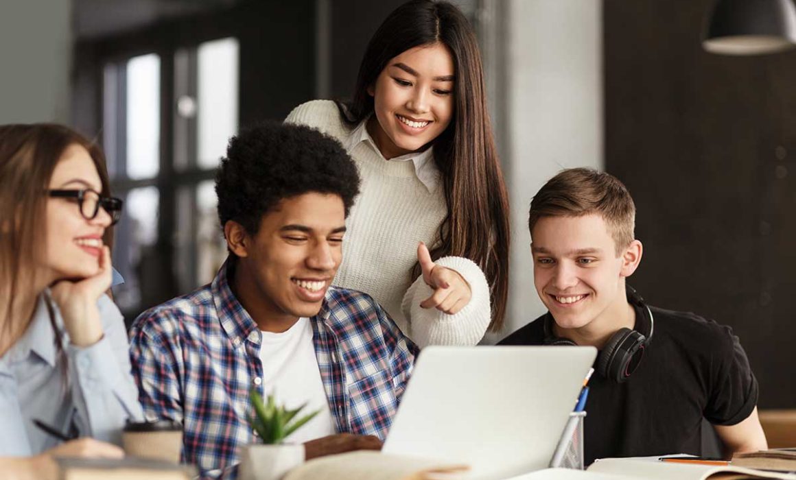 Students around laptop